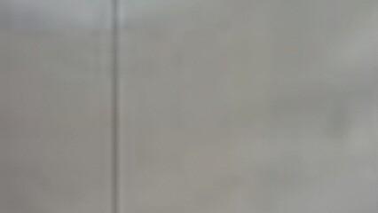 Slightly blurred light grey textured background