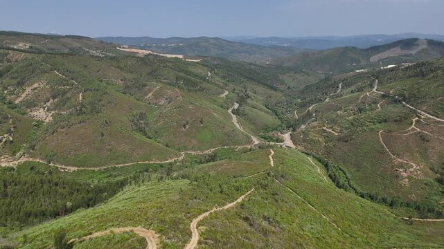 Stand on the precipice and soak in the majestic beauty of the mountains at Miradouro do Zebro, captured from above by drone. A journey to this iconic viewpoint in Portugal is rewarded with unforgettab