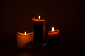 Candles in the dark close-up on a dark background