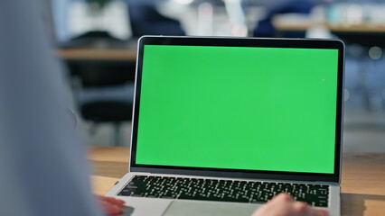 Freelancer working green screen laptop sitting office coworking space closeup. 
