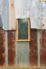 Old Wooden Window on Abandoned Sheet Metal Hut