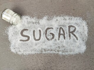 Flat lay composition with phrase sugar on grey background