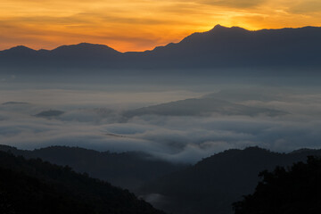 Obraz premium Morning light in the mountains. Fog in the valley. Sunlight entering the valley and on the mountains. Beautiful summer morning