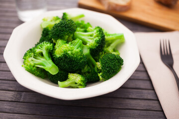 Boiled broccoli inflorescences in plate