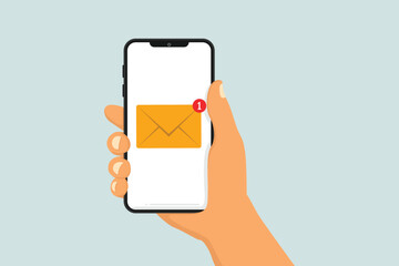 New email notification on phone. New unread message. Letter on phone screen. Hand holding phone.