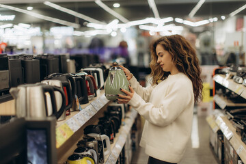 Young Woman Shopping for Electronics in Retail Appliance Store