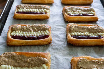 Puff pastry tarts with cream cheese, cherry jam, peanut butter. Dessert. pastry