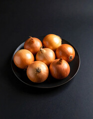 Onions on a black background
