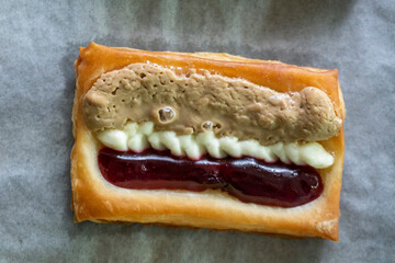 Puff pastry tarts with cream cheese, cherry jam, peanut butter. Dessert. pastry