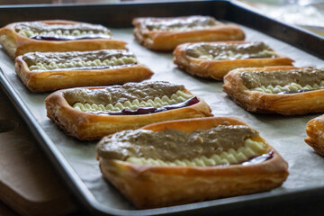 Puff pastry tarts with cream cheese, cherry jam, peanut butter. Dessert. pastry