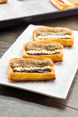 Puff pastry tarts with cream cheese, cherry jam, peanut butter. Dessert. pastry