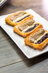 Puff pastry tarts with cream cheese, cherry jam, peanut butter. Dessert. pastry