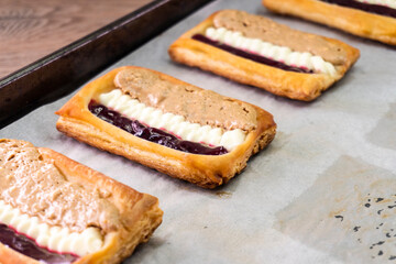 Puff pastry tarts with cream cheese, cherry jam, peanut butter. Dessert. pastry