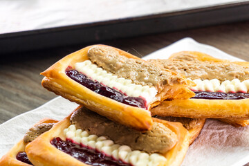 Puff pastry tarts with cream cheese, cherry jam, peanut butter. Dessert. pastry