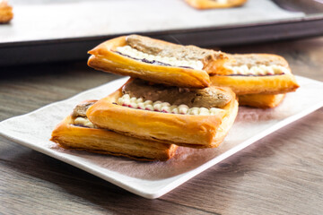 Puff pastry tarts with cream cheese, cherry jam, peanut butter. Dessert. pastry