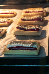 Puff pastry tarts with cream cheese, cherry jam, peanut butter. Dessert. pastry