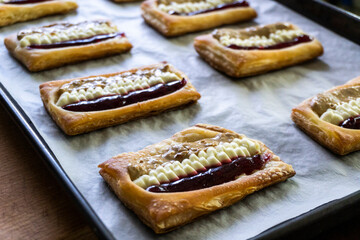 Puff pastry tarts with cream cheese, cherry jam, peanut butter. Dessert. pastry