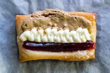 Puff pastry tarts with cream cheese, cherry jam, peanut butter. Dessert. pastry