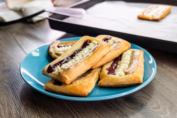 Puff pastry tarts with cream cheese, cherry jam, peanut butter. Dessert. pastry