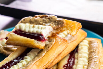 Puff pastry tarts with cream cheese, cherry jam, peanut butter. Dessert. pastry