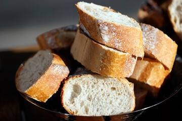 Bread basket with organic baguette slices.
