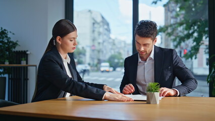 Professional colleagues discussing teamwork at corporate conference room closeup