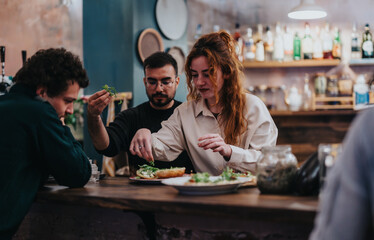 A warm gathering of friends preparing and sharing meals at a rustic, inviting bar. The atmosphere is filled with comfort and community spirit, showcasing food preparation with fresh ingredients.
