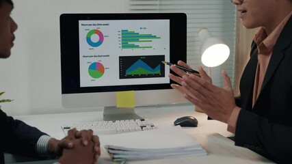 Business meeting analyzing data trends office digital presentation professional environment collaborative viewpoint - Powered by Adobe