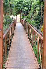 Metal footbridge in the highlands region. Kontum. Vietnam.