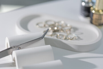 Manicure essentials on light background, clean elegant composition for beauty content.
