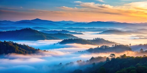 Fototapeta premium Muted colors of foggy hills against blue sky at dawn