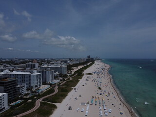 A stunning drone view of Miami Beach South Pointe showcasing the beach, park, and iconic skyline buildings.
