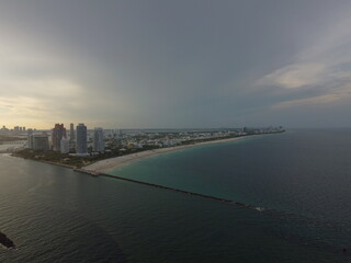 A stunning drone view of Miami Beach South Pointe showcasing the beach, park, and iconic skyline buildings.