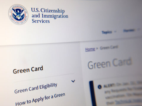 London, UK, 06.10.2025: US Immigration and Customs Enforcement with How to Apply for a Green Card (Permanent Resident Card) web page