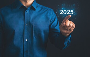 Man in blue shirt touches 2025, futuristic concept