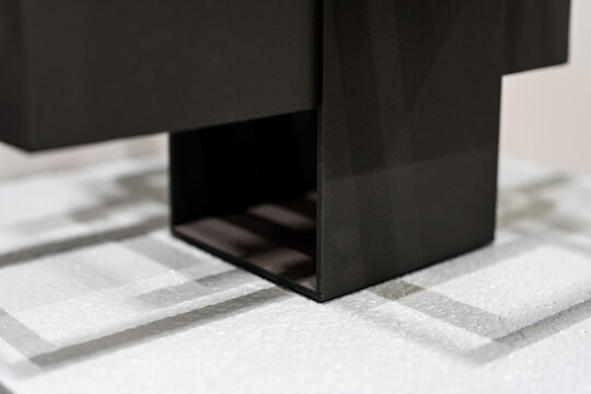 Black hollow cube on the table