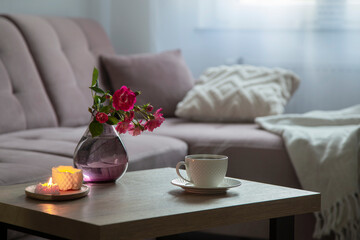 coxy interior with bouquet of roses and cup of coffee