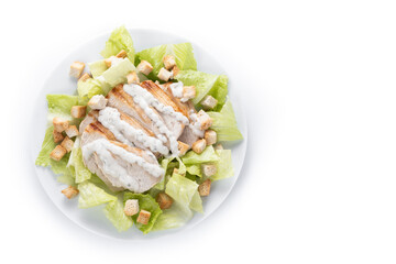 Crunchy Caesar salad with chicken isolated on white background. Top view. Copy space