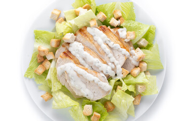 Crunchy Caesar salad with chicken isolated on white background