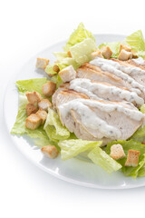 Crunchy Caesar salad with chicken isolated on white background