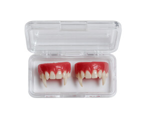 A pair of vampire fangs in a case, ready for a spooky Halloween look.