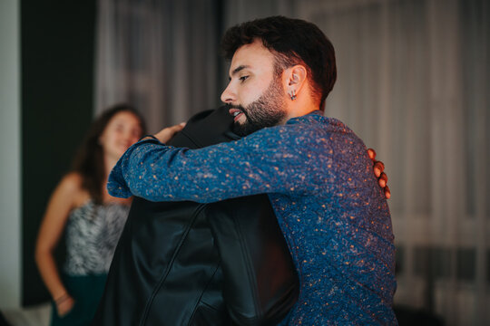 An emotional embrace between two close friends, expressing trust, love, and support in an indoor setting. The warm ambiance highlights the genuineness and closeness of their relationship.