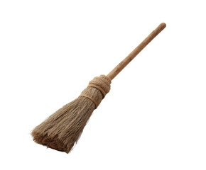 A traditional broom with a wooden handle and straw bristles on black background.