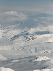 Aerial view of snowy mountains landscape.