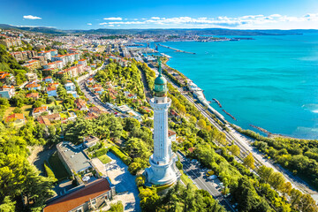 Trieste, Italy. Trieste lighthouse Phare de la Victoire and cityscape panoramic aerial view