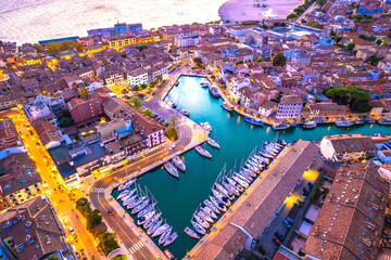 Gradi, Italy. Town of Grado colorful architecture and channels aerial view