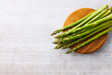 Fresh Green Asparagus on White Wooden Background