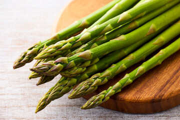 Fresh Green Asparagus on White Wooden Background