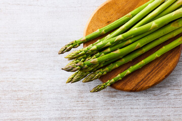 Fresh Green Asparagus on White Wooden Background