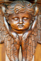 Collegiate Church of Saint-Jacques le Majeur. Wooden sculpture of a cherub. Sallanchess. France.